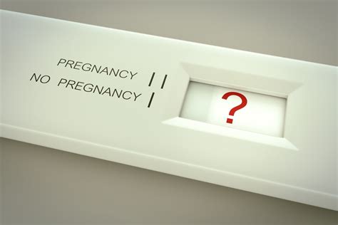 tearing a first response pregnancy test|pregnancy test question mark.